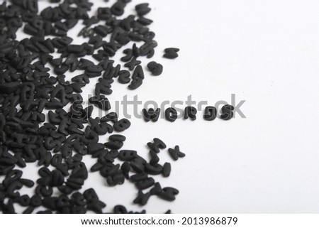White background with small black letters. White background with many letters with the word words written. The word words written with small letters in black and white background. Royalty-Free Stock Photo #2013986879