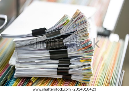 close up stacking of office working document Paperwork business with paper clip folder