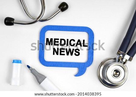 Medicine concept. On the table is a stethoscope, a marker and a sign with the inscription - MEDICAL NEWS
