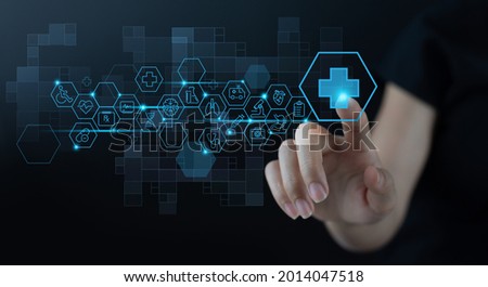 Medical technology, Telemedicine, virtual hospital, E-health, online medical concept. Woman hand touching health button on virtual screen with medical icons set on dark background