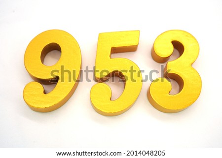   Arabic numerals 953 gold on white background                                