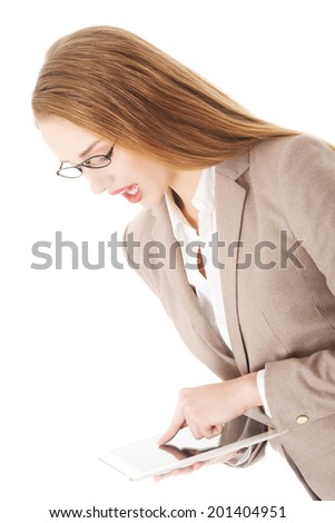 Beautiful caucasian business woman holding tablet. Isolated on white.