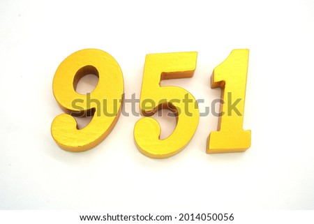   Arabic numerals 951 gold on white background                                