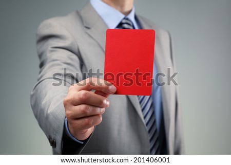 Showing the red card concept for bad business practice, exclusion or criminal activity Royalty-Free Stock Photo #201406001