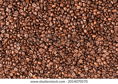 Roasted coffee beans background. Coffee beans texture.