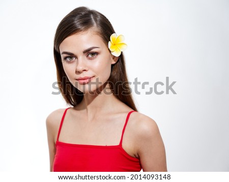 beautiful woman clear skin red t-shirt yellow flower