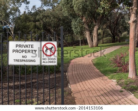 Warning signs against trespassing into a private property in Australia