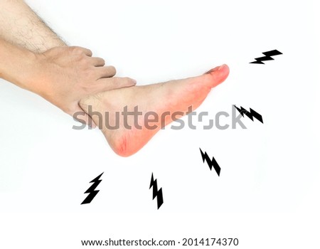 Tingling and burning sensation in foot of Asian young man with diabetes. Sensory neuropathy problems. Foot nerves problems. Isolated on white.