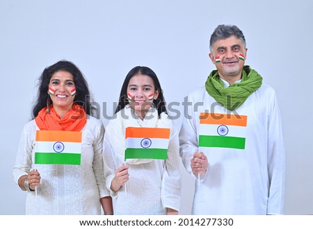 Family holding Indian flag on Independence day India Royalty-Free Stock Photo #2014277330