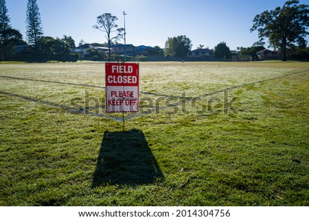 A sports field closed due to early morning dew and fog.