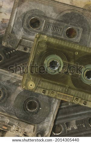 Vintage audio cassette tapes placed next to each other. Obsolete technology of audio recording and playback format audio cassette tapes,top view. 80s retro music background.  