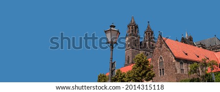 Banner with Cathedral of Magdeburg at dark blue sky solid background with copy space, Magdeburg, Germany. Concept of historical architecture heritage