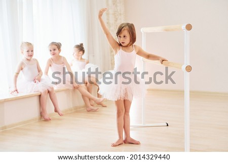 Practicing dance moves. Little ballerinas preparing for performance.