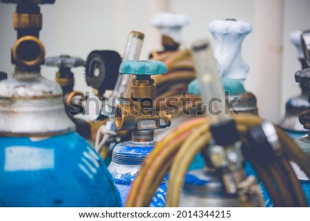 Welding equipment valve acetylene gas cylinder tank with gauge regulators manometers. Royalty-Free Stock Photo #2014344215