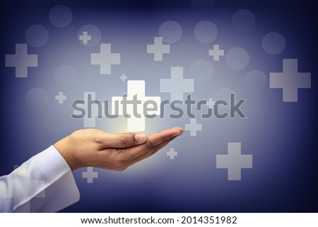 Hand holding plus sign virtual means to offer positive thing (like benefits, personal development, social network, health insurance) with copy space