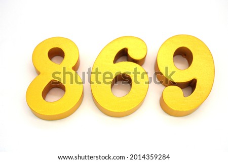   Arabic numerals 869 gold on white background                                