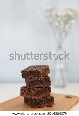 Tasty brownies and small flowers