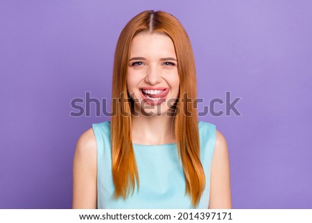 Photo of charming happy positive young woman lick teeth tasty good mood isolated on purple color background