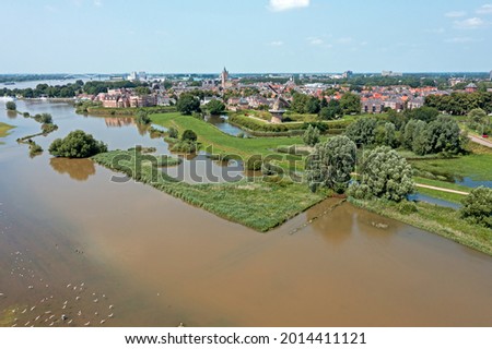 Aerial from the city Gorinchem at the river Merwede in the Netherlands in a flooded landscape