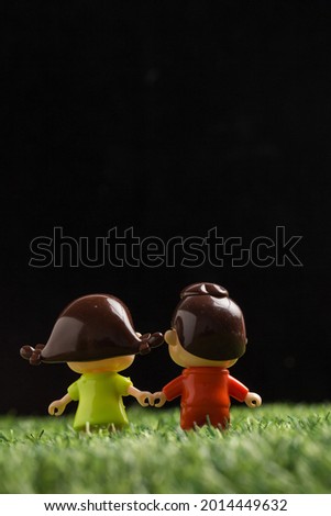 Dolls in the grass at night