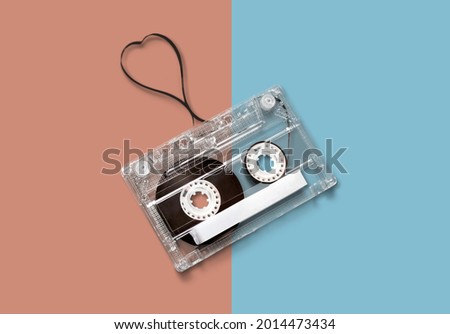 Old retro audio cassette on two color background