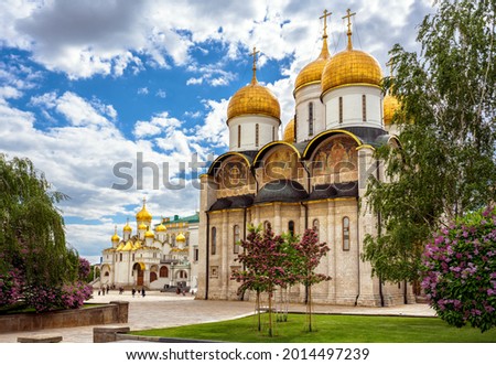 Dormition (Assumption) Cathedral overlooking Annunciation cathedral, Moscow Kremlin, Russia. Scenic view of old Russian Orthodox churches in Moscow center. This place is famous landmark of Moscow.  Royalty-Free Stock Photo #2014497239