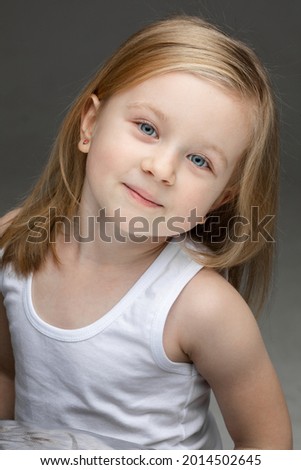 Adorable toddler smiling to the camera at photo session