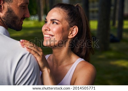 Loving woman admiring her cute young boyfriend