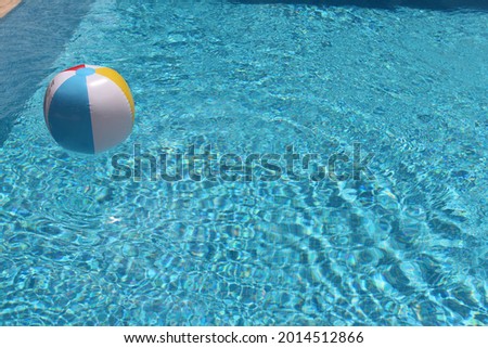 Beach Multi-Color balls in the swimming pool clear shot - blue background - free space for text - PC Website background 
