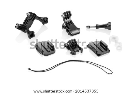 Set of black plastic action camera acessories on white background with reflection underneath