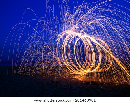 Light painting - photographic technique, at dusk, in the blue hour. Long exposure.