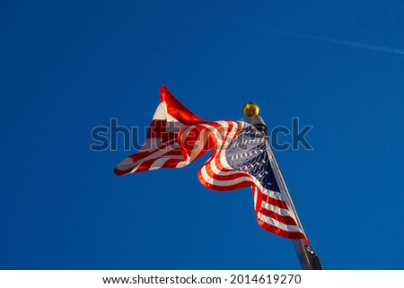 A picture of a flag waving in the wind.