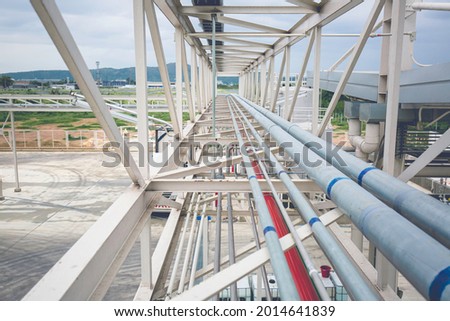 Steel long pipes rack work at high factory during refinery Petrochemistry industry chemical methanol. Royalty-Free Stock Photo #2014641839