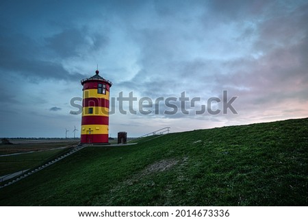A scenic view of the Pilsum lighthouse in Krummhorn, Germany Royalty-Free Stock Photo #2014673336