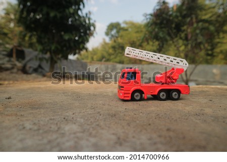 
Toy fire truck on nature background