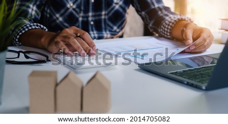 Business man waiting signing agreement contract for buying house or condominium. Bank manager concept. Royalty-Free Stock Photo #2014705082