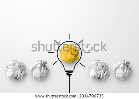 Concept creative idea and innovation. Paper scrap ball yellow colour outstanding different group with light bulb symbol Royalty-Free Stock Photo #2014706735