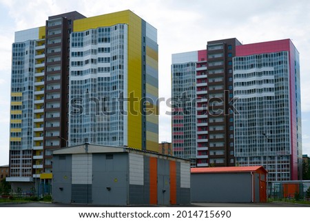 Two high-rise student residences tiled with tiles and glass. Nearby color-coded hostels. Royalty-Free Stock Photo #2014715690