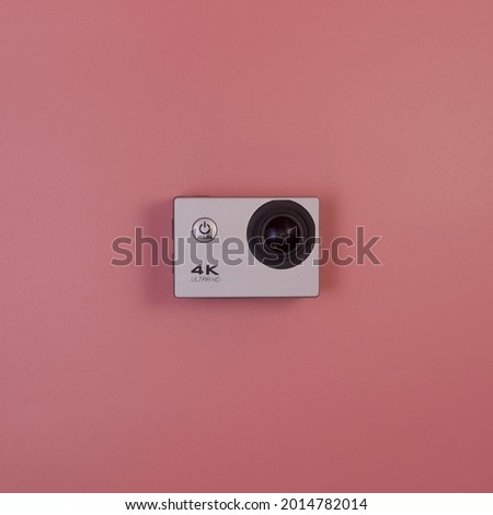 Action Camcorder 4k (no name) isolate on pink background