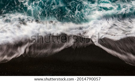 waves of the sea with a silk effect, shot by a drone on the coasts of the Ligurian sea