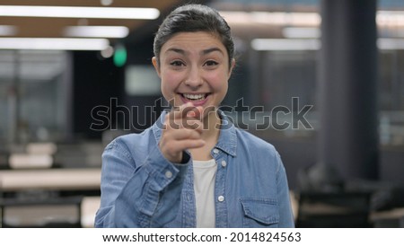Portrait of Indian Woman Pointing at Camera