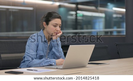 Tired Indian Woman Taking Nap While Working in Office