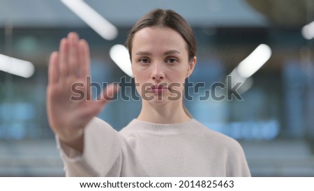 Portrait of Woman Showing Stop Sign by Hand