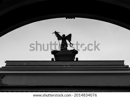 a monochromic picture of the statue of angel on the entrance to the palace square in ``Saint Petersburg