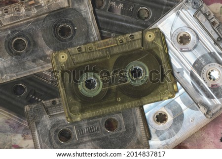 Vintage audio cassette tapes placed next to each other. Obsolete technology of audio recording and playback format audio cassette tapes,top view. 80s retro music background.  