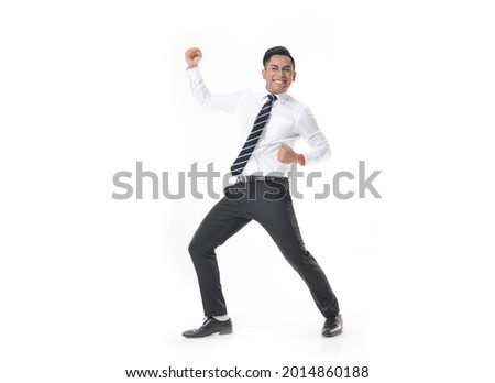 Full length
young business man,in white shirt, tie with black pants make winning gesture. Celebrating victory or success. on white background

