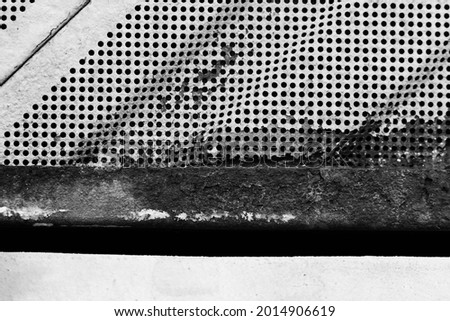 Perforated, painted and dirty sheet metal, the background of an industrial style.