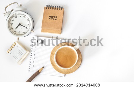 Calendar 2022 and alarm clock on office table. to-do list and plan for next year. flatlay composition Royalty-Free Stock Photo #2014914008