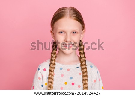 Photo of charming adorable schoolgirl dressed dotted sweater smiling isolated pink color background