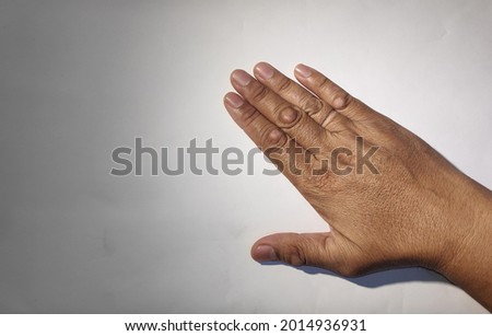 asian man right hand with calloused fingers 